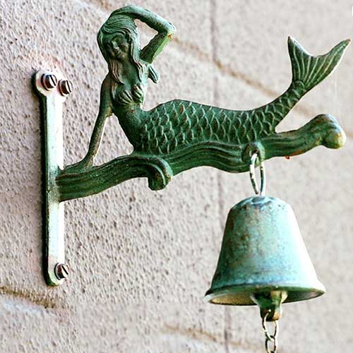 Florida Mermaid Trail statue with bell. 