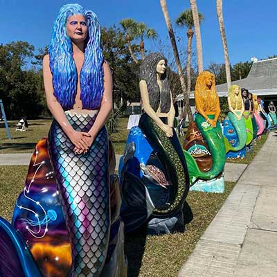 row of mermaid statues